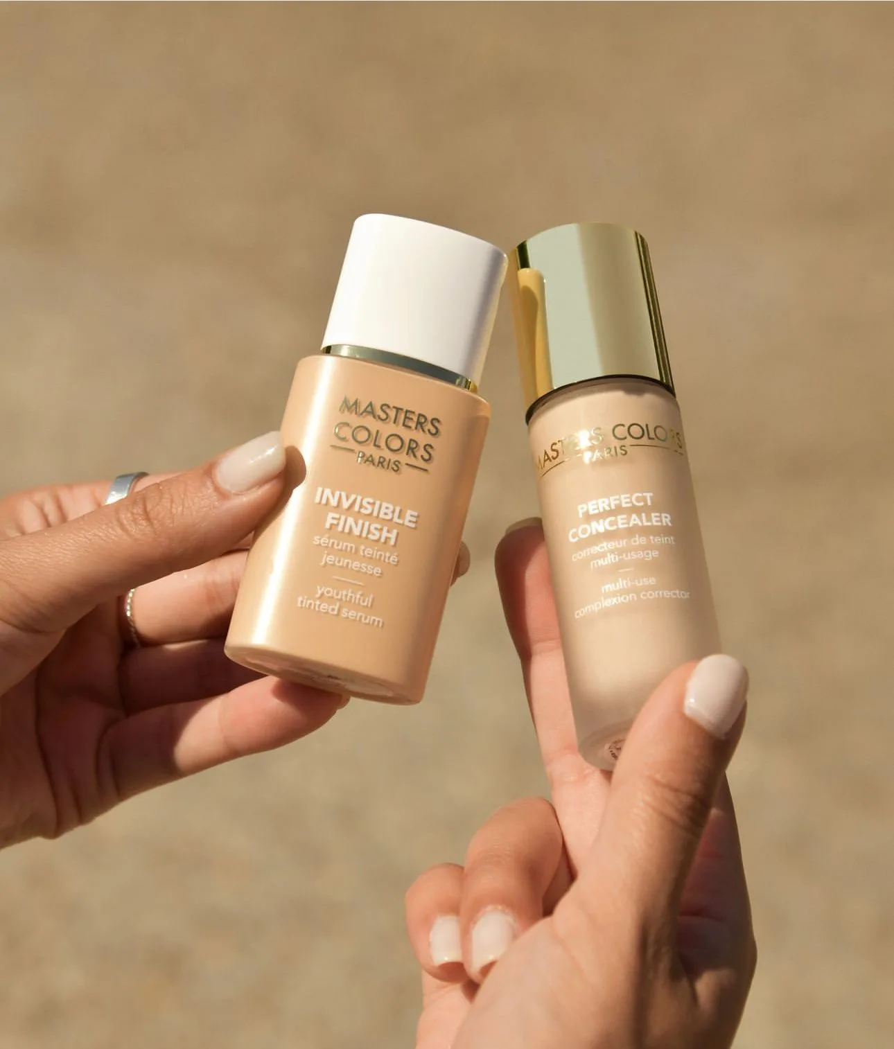 Two Masters Colors foundations held in hand