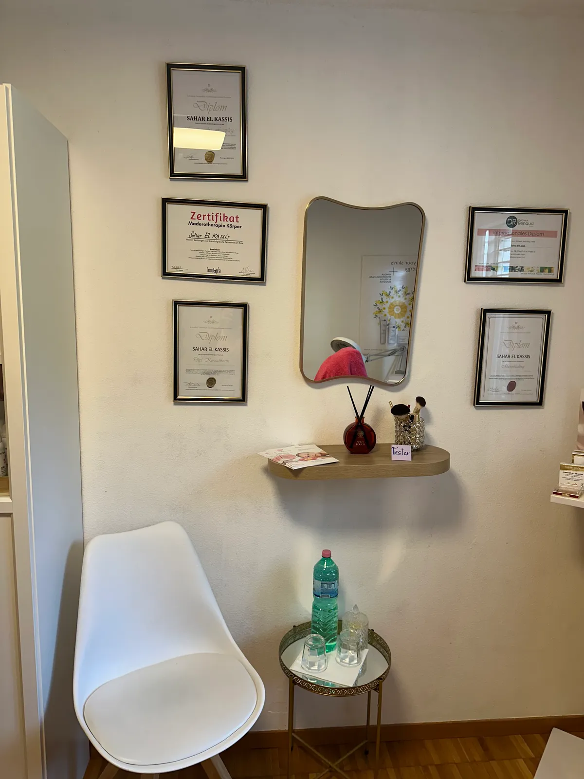 Framed diplomas and certificates in the studio
