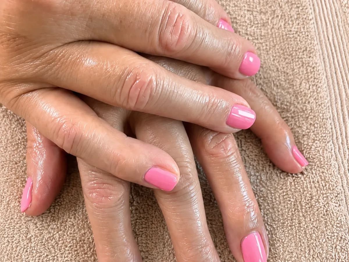 Manicure result with delicate pink nails
